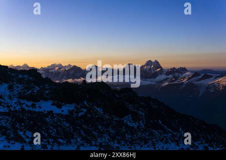 mountain peaks in the rays of early morning dawn, panoramic natural ...