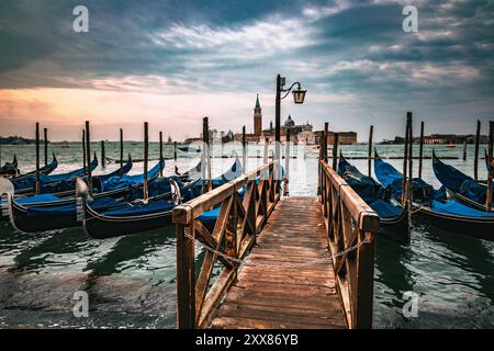 Gondolas Moored at the Pier with a View of the Church of San Giorgio Maggiore, Venice Stock Photo