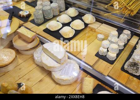 BEZIERS, FRANCE - OCTOBER 3, 2021: Cheese shop at the market hall (Les Halles) in Beziers, France. Beziers is a subprefecture town of the Herault depa Stock Photo