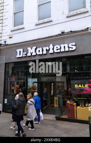 DUBLIN IRELAND JULY 5 2024 People walk by Dr. Martens brand shoe store at famous Grafton Street in downtown Dublin Ireland Stock Photo Alamy