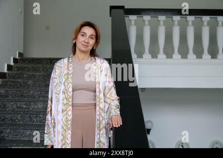 KYIV, UKRAINE - AUGUST 22, 2024 - Leviza Dzhelialova, the spouse of Crimean Tatar Mejlis first deputy speaker Nariman Dzhelial, gives an interview to the Ukrinform National News Agency, Kyiv, capital of Ukraine. Nariman Dzhelial was sentenced by the Russian-controlled Supreme Court of Crimea to 17 years for sabotage in prison on 21 September 2022. He returned to Ukraine on 28 June 2024. Stock Photo