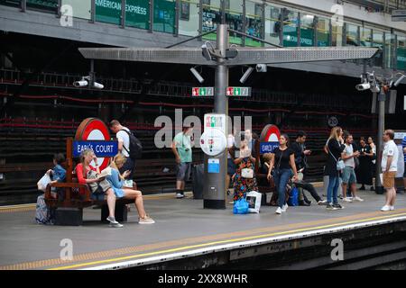 LONDON, UK - JULY 13, 2019: Passengers wait at London Underground station Earl's Court. London Underground is the 11th busiest metro system worldwide Stock Photo