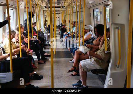 LONDON, UK - JULY 13, 2019: Passengers ride London Underground train on District Line. London Underground is the 11th busiest metro system worldwide w Stock Photo