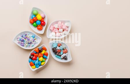 Various colorful candies, lollipops. Flat lay with copy space Stock Photo