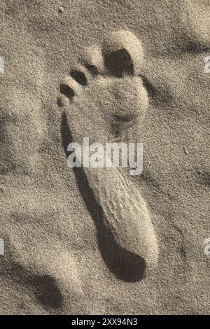 Sand human foot print at La Cinta beach in Sardinia Costa Smeralda region in Italy. Stock Photo