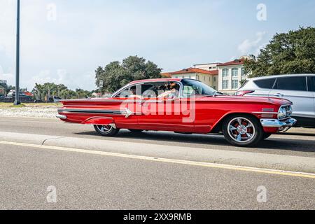 Gulfport, MS - October 05, 2023: Wide angle side view of a 1960 Chevrolet Impala Sport Coupe at a local car show. Stock Photo