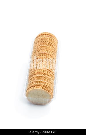 Thin  cracker cookies in plastic pack isolated on white Stock Photo