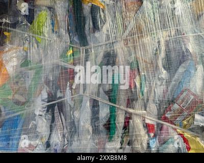 Plastic bottles,compressed into bales and ready for recycling. Zero waste concept. Stock Photo