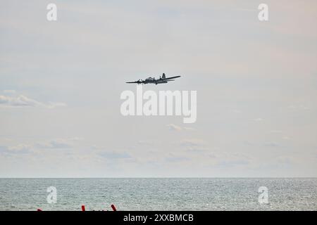 Clacton on Sea, UK, 24 Aug 2024. Duxford Imperial War Museum's  B-17 Flying Fortress 'Sally B' flys over crowds in Clacton. Credit: Martin Suker/Alamy Live News Stock Photo