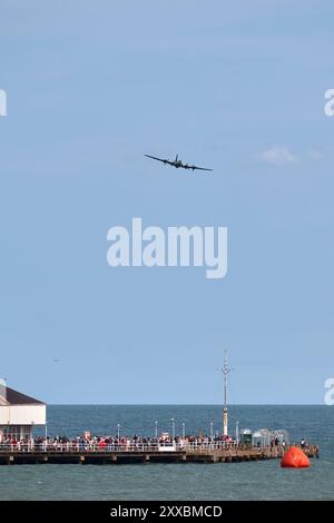 Clacton on Sea, UK, 24 Aug 2024. Duxford Imperial War Museum's  B-17 Flying Fortress 'Sally B' flys over crowds in Clacton. Credit: Martin Suker/Alamy Live News Stock Photo