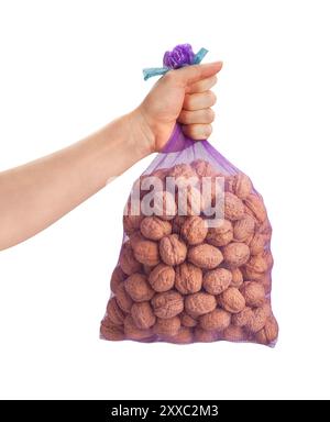 walnuts sack in hand path isolated on white Stock Photo