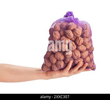 walnuts sack in hand path isolated on white Stock Photo