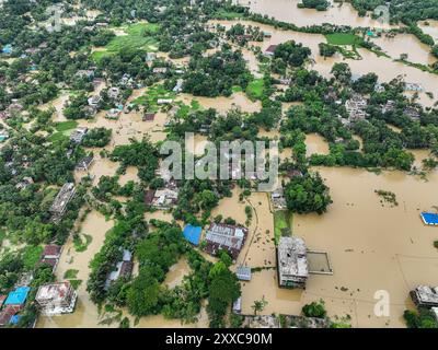 Dhaka, Bangladesh. 23rd Aug, 2024. An aerial view shows flooded villages in the Mohipal, area of Feni district in Chittagong division, Bangladesh, on August 23, 2024. At least 13 people are killed; a total of 43 upazilas in several districts are affected by the flash floods, and about 189,663 families are marooned. Credit: SOPA Images Limited/Alamy Live News Stock Photo