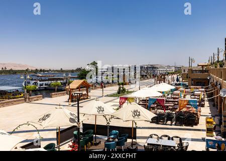 East bank of the Nile, riverside park with ports, downtown, city center, Luxor, Egypt, North Africa, Africa Stock Photo