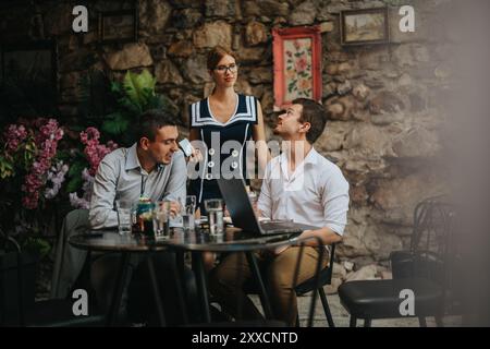 Colleagues engaging in a collaborative outdoor team meeting Stock Photo