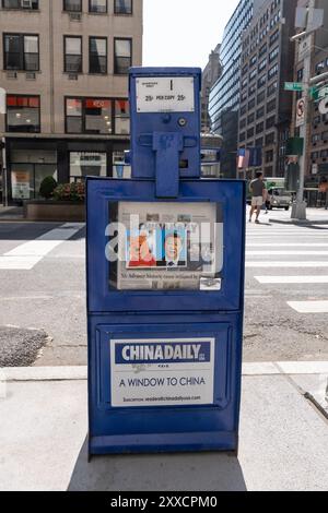 New York, USA. 23rd Aug, 2024. Sticker with an image of Disney character Winnie the Pooh and China President Xi Jinping seen on the box selling conservative newspaper China Daily on 23rd street in New York on August 23, 2024. When Xi Jinping was seen visiting President of The US Barack Obama they were compared by Chinese activists to comic characters Winnie the Pooh and Tigger from Disney animation. This became a meme to satirize Chinese President and Disney movie and usage of Winnie the Pooh character was banned in China. (Photo by Lev Radin/Sipa USA) Credit: Sipa USA/Alamy Live News Stock Photo