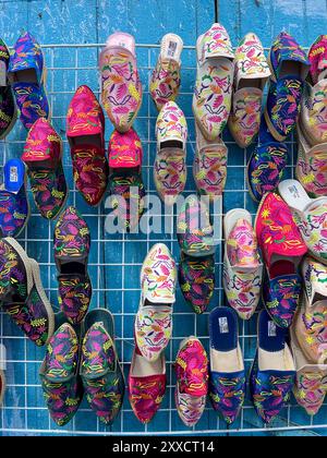 Traditional Moroccan shoes for sale in Chefchaouen, Morocco Stock Photo
