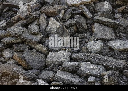 Broken up old asphalt in a pile Stock Photo