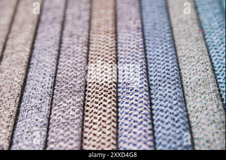Colorful and bright fabric samples of furniture and clothing upholstery. Close-up of a palette of textile abstract stripes of different colors Stock Photo