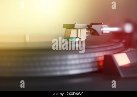Close up picture of a record player, playing a record. Sunbeam Stock Photo