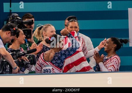 Simone Biles USA) celebrates with teammates after completing her floor