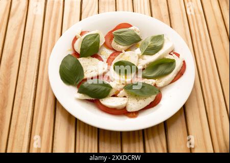 Plate with mozzarella, tomatoes and basil Stock Photo