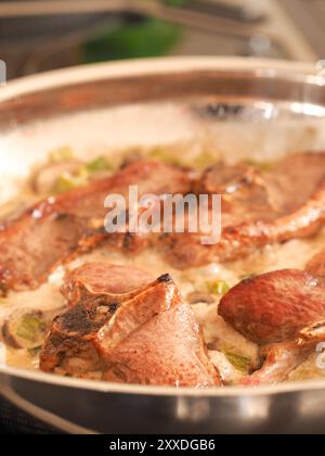 Tasty organic lamb chop with mushroom cream sauce, food concept Stock Photo