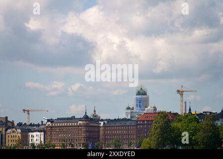 Helsinki, Finland. June 29, 2024 - Cloudy sky over skyline with Helsinki cathedral under renovation Stock Photo