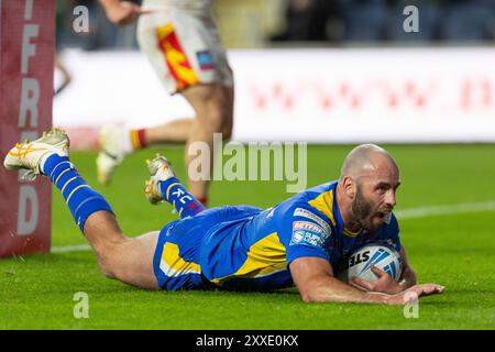 Matt Frawley ( 7 ) of Leeds Rhinos scores a try in the match against the Catalans Dragons. Stock Photo