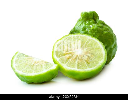 Fresh green kaffir lime fruit or bergamot with half and slice or piece is isolated on white background with clipping path. Stock Photo