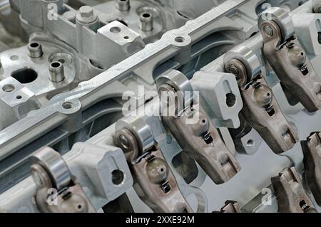 Cylinder head of an internal combustion engine with the cover removed, inner parts are visible. Close up shot, selective focus, technology background. Stock Photo