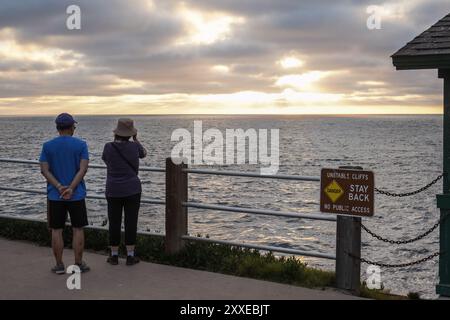 San Diego, California, USA. 18th Aug, 2024. People watch sunset at La Jolla Cove. Coastline in San Diego absorbs plenty of people to visit and do water activities there. The coastline in San Diego is approximate 70 miles and multiple beaches along with the coastline. The beaches along the coastline are popular tourism spots in San Diego and busy everyday. (Credit Image: © Michael Ho Wai Lee/SOPA Images via ZUMA Press Wire) EDITORIAL USAGE ONLY! Not for Commercial USAGE! Stock Photo