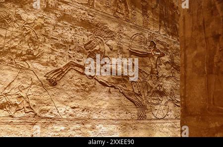 Ancient egyptian hieroglyphs carved on inner walls of Abu Simbel temple in Aswan, Egypt Stock Photo