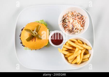 fresh tasty burger and French fries in white dish isolated on white background, top view Stock Photo