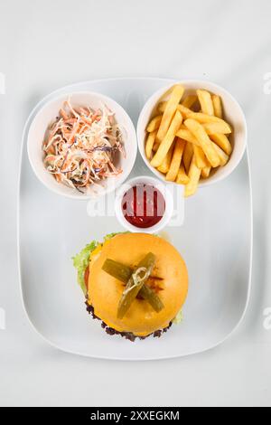 fresh tasty burger and French fries in white plate isolated on white background, top view Stock Photo