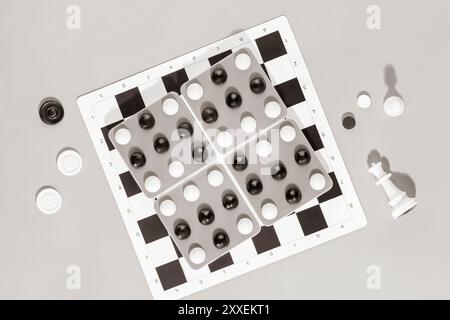 Board games. Various board games on grey background with chess pieces and checkers. Free time at home with family. Flat lay Stock Photo