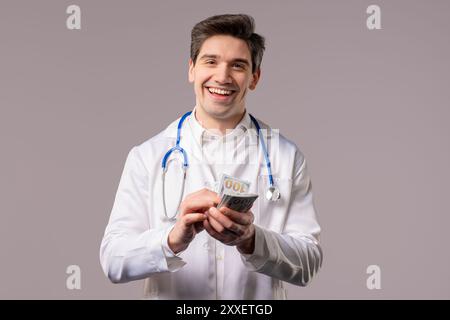 Rich doctor man counting money. Handsome medical health care worker in white coat with USD dollars banknotes. White studio background. High quality 4k Stock Photo