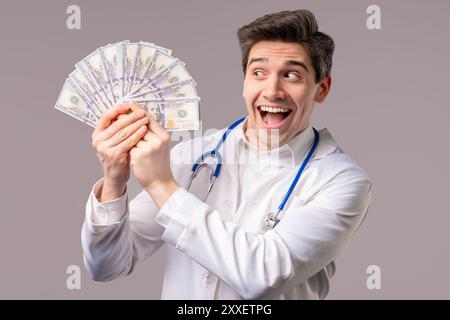 Rich Doctor Man with Usd money. Handsome Medical Health Care Worker In White Coat with salary, payment. Jackpot, win. High quality photo Stock Photo