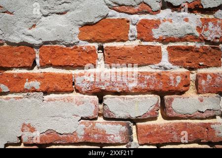 Brick wall with plaster residue in Christianfeld, Denmark. Stock Photo