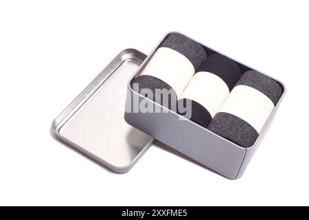 man's socks in metal box, isolated on white. Stock Photo