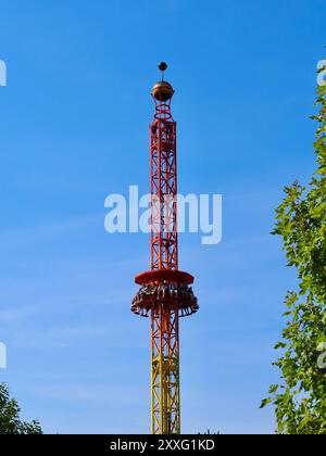 Energylandia, Poland - August 23, 2024: People free falling from tower ride at amusement park. Free Fall Tower in the amusement park is filled with a Stock Photo