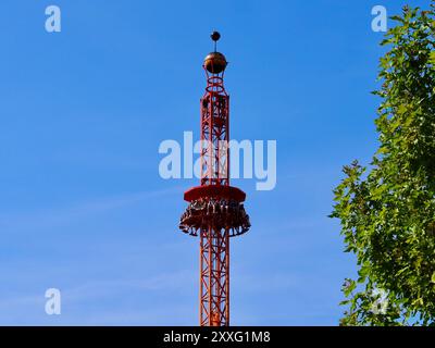 Energylandia, Poland - August 23, 2024: People free falling from tower ride at amusement park. Free Fall Tower in the amusement park is filled with a Stock Photo