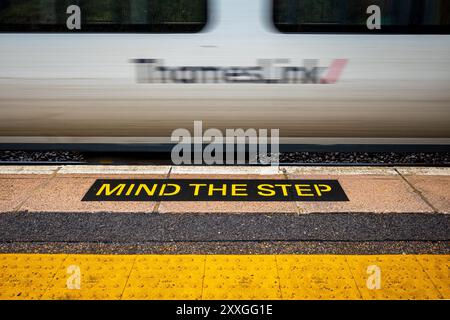 Thameslink Train - a Thameslink Train passes through Royston station on its journey from Brighton to Cambridge, crossing London. Stock Photo