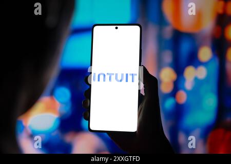 In this photo illustration, the Intuit Inc. logo is displayed on a smartphone screen. Stock Photo