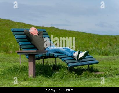 Relaxation on a park bench Stock Photo