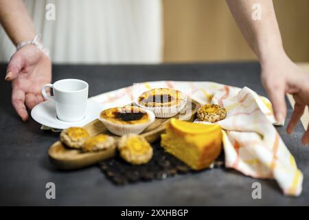 Traditional Portuguese sweets with main focus on famous Pastel de Nata, Faro, Portugal, Europe Stock Photo