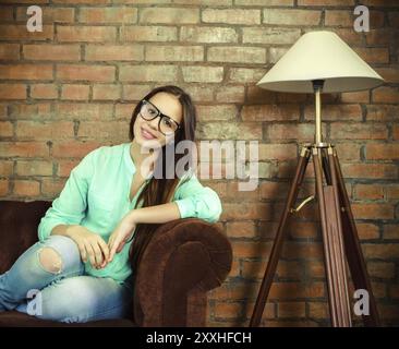 Close up portrait of a beautiful cute teen girl in the living room Stock Photo