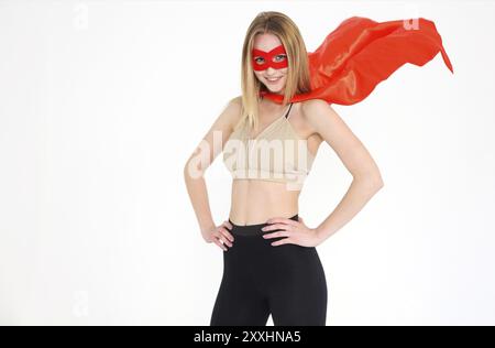 Young superwoman wearing sport clothes and looking fun Stock Photo