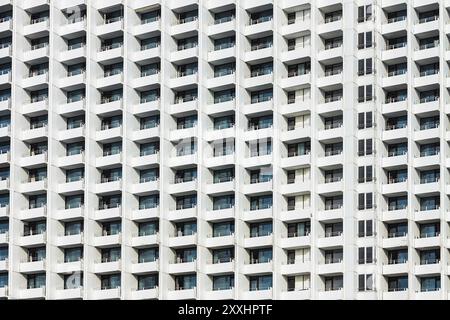 Front of a tower block with many windows Stock Photo