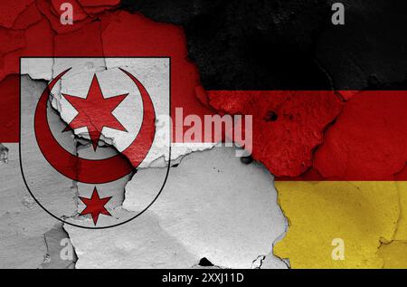 Flags of Halle and Germany painted on cracked wall Stock Photo